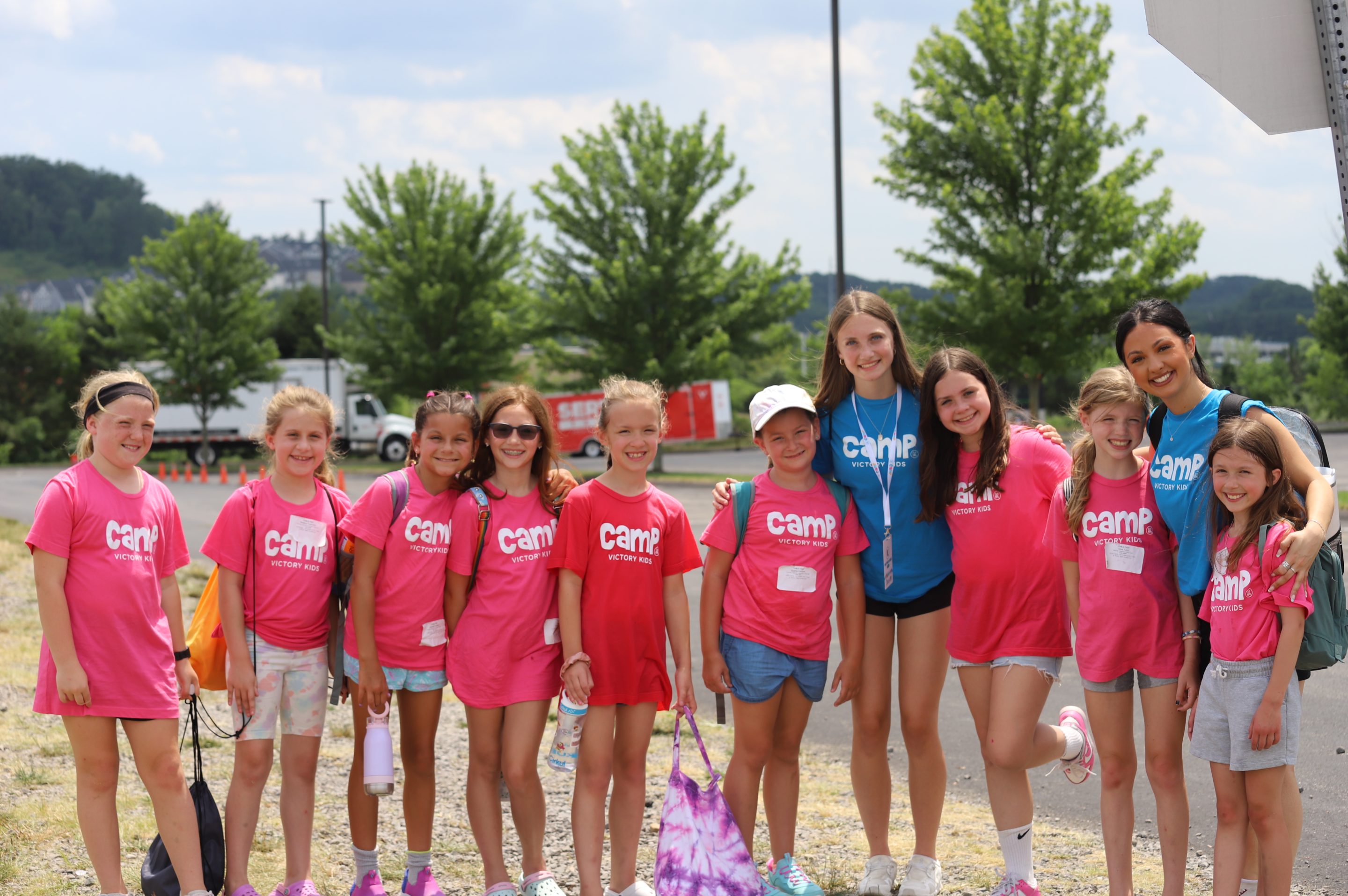 Young girls in the auditorium at Victory Kids Camp